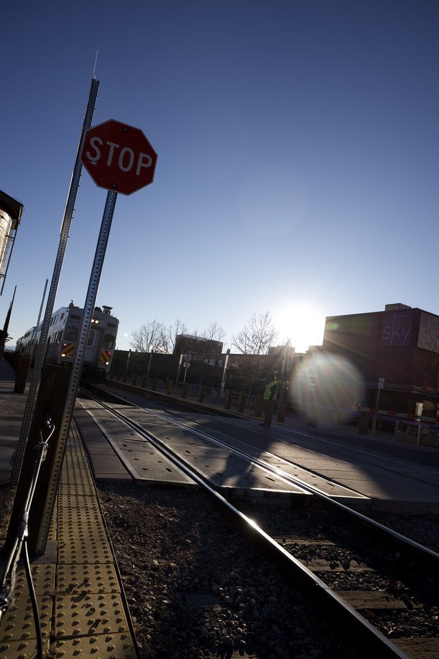 Railroad Crossing at Sunset with Stop Sign