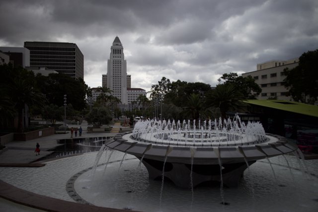 City Fountain in a Cloudy Metropolis