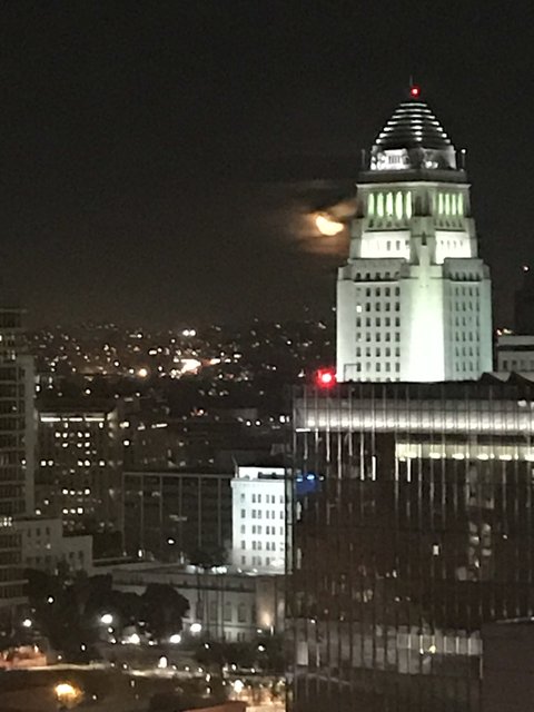 Full Moon over the City Skyline