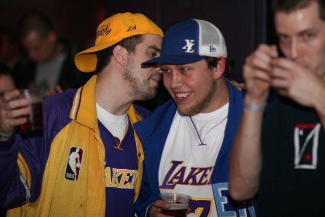 Lakers fans celebrate with a beer huddle