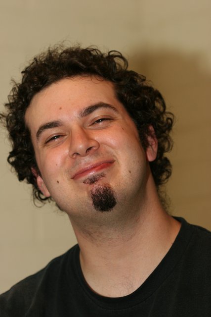 Smiling Man with Curly Hair