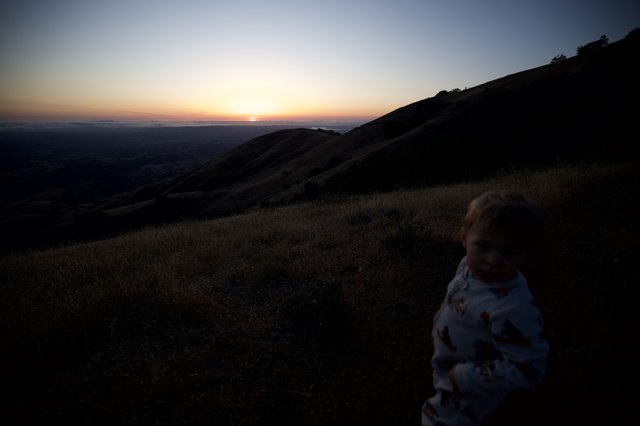 Toddler Watches Sunset from Mount Diablo Summit