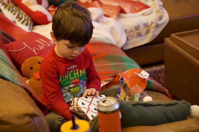 Christmas Morning Joy: Child Opening Presents