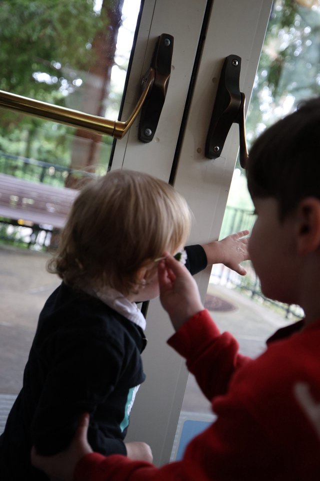 Parent Comforting Young Child by Open Door