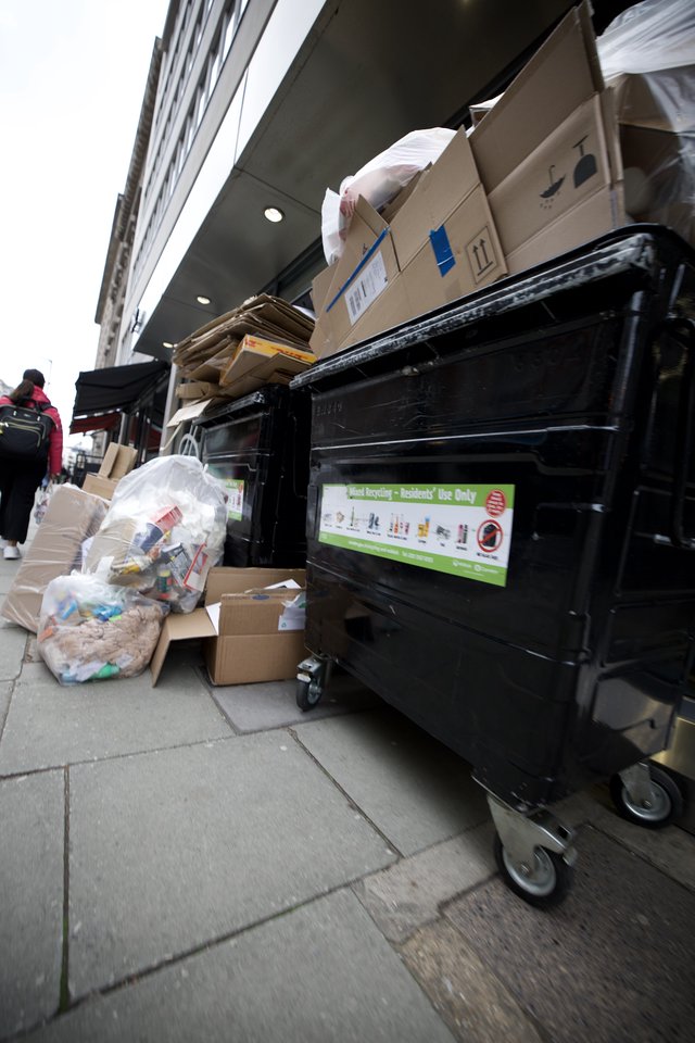 Overflowing Recycling Bins on London Street