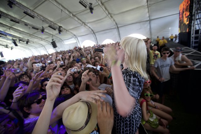 Blonde Bombshell Rocks Coachella with Microphone in Hand