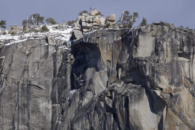 Dramatic Granite Cliff Face with Winter Snow