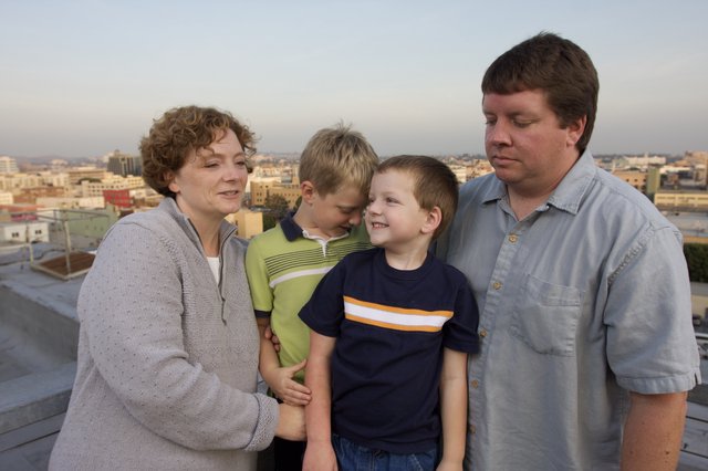 Family Portrait on Urban Rooftop at Dusk