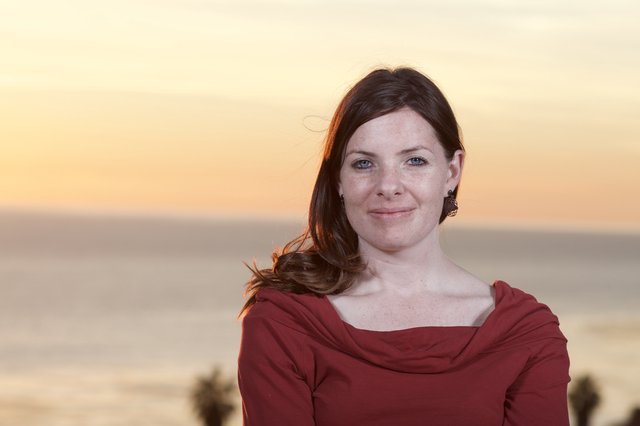 Woman in Red at Golden Hour Beach Sunset
