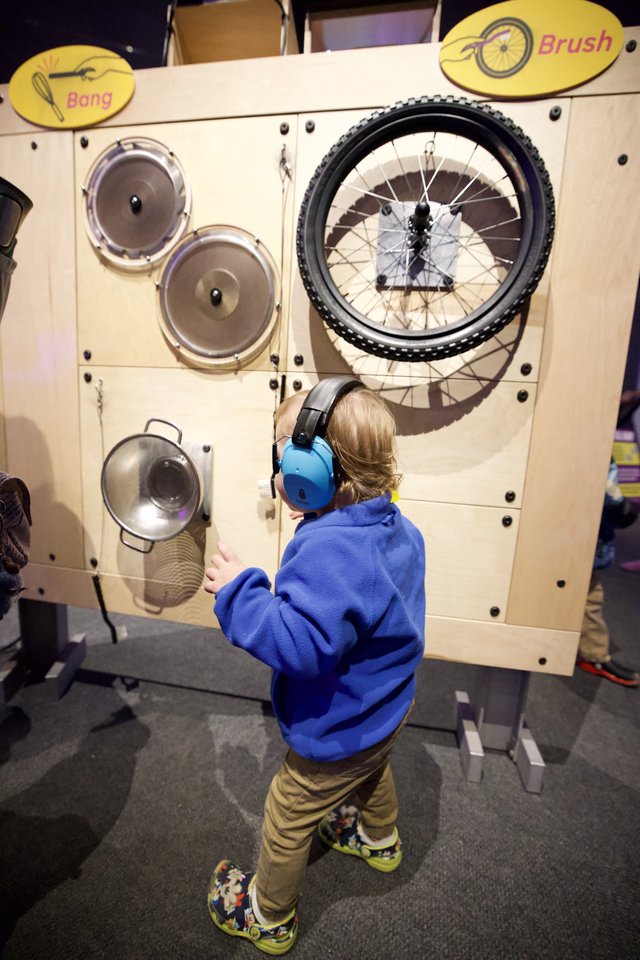 Child Explores Interactive Sound Exhibit at Museum