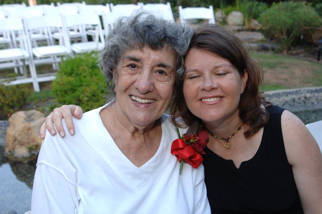 Two Women Share a Joyful Moment at Wedding