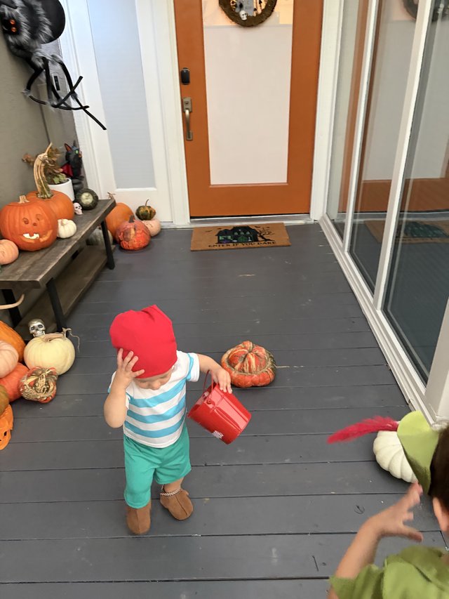 Toddler in Halloween Costume at Festive Front Porch