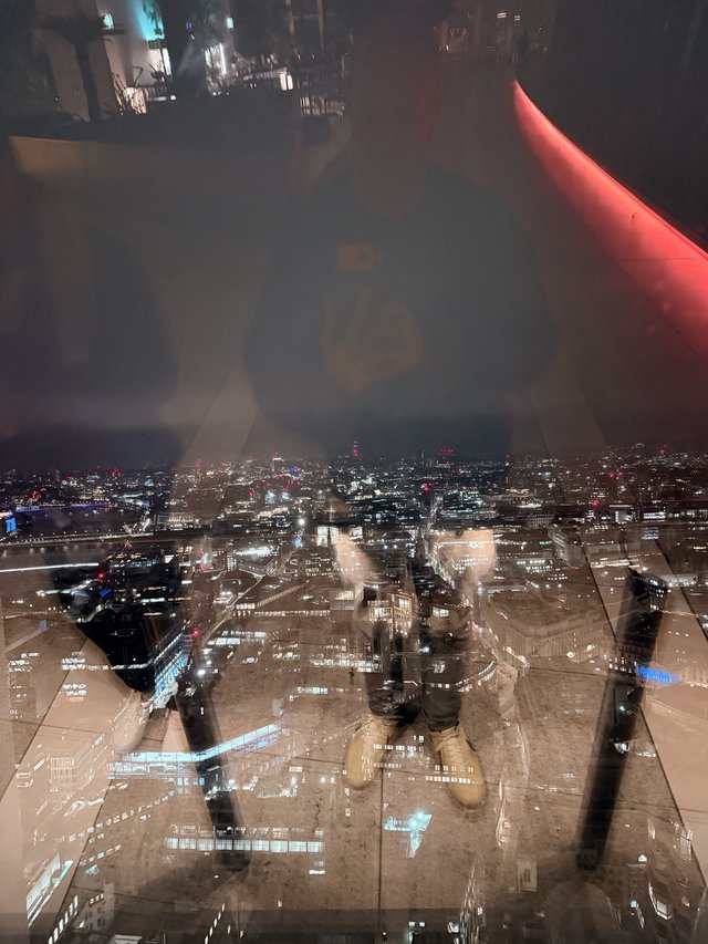 Double Exposure: London Skyline Through Indoor Reflection