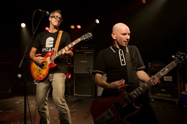 Two Guitarists Rocking the Stage at Bad Religion Concert
