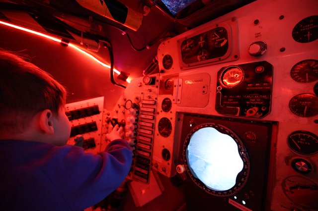Navigator Operating Submarine Periscope Under Red Light