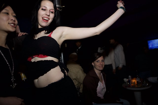 Woman Dancing Freely at Underground Nightclub Event