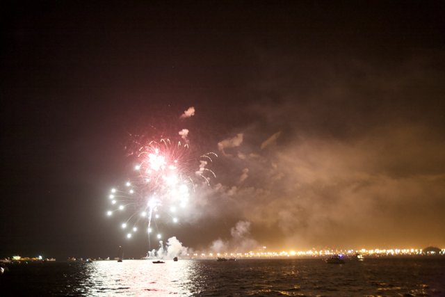 Boats and Fireworks Light up the Night Sky