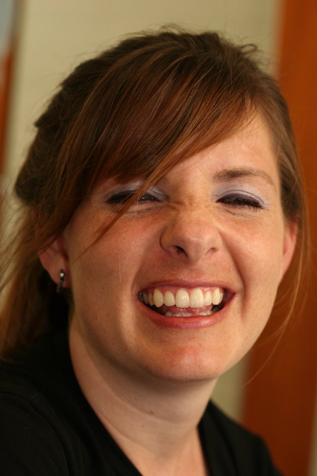 Joyful Woman Laughing with Eyes Closed
