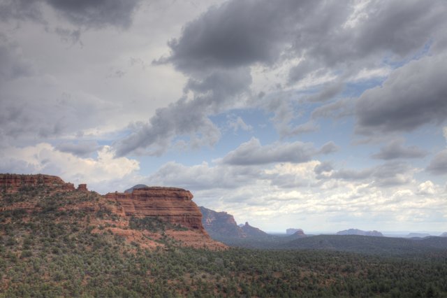 Majestic Red Rock Formation with Clouds Above