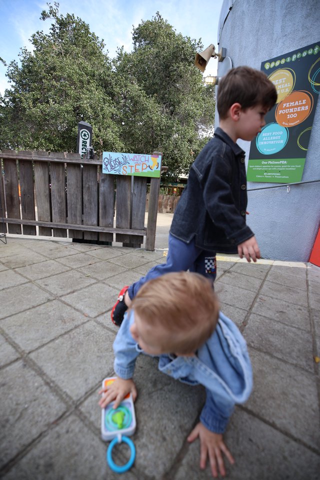 Children Exploring Interactive Outdoor Science Exhibit
