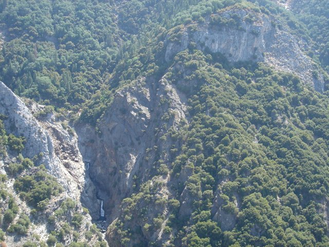 Majestic Mountain Range with Cascading Waterfall