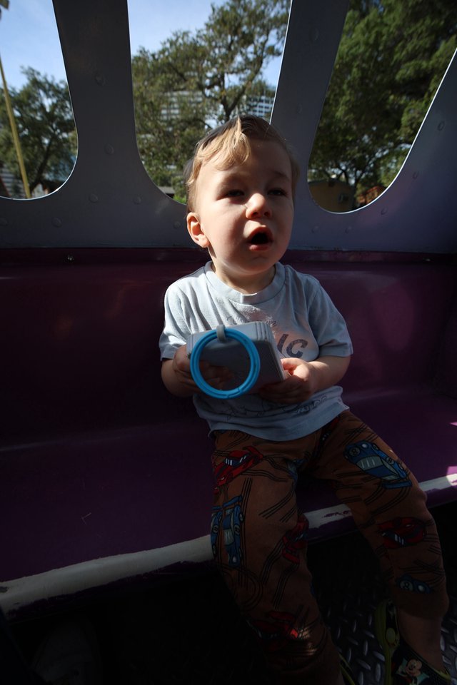 Toddler Playing with Blue Ring in Bounce House