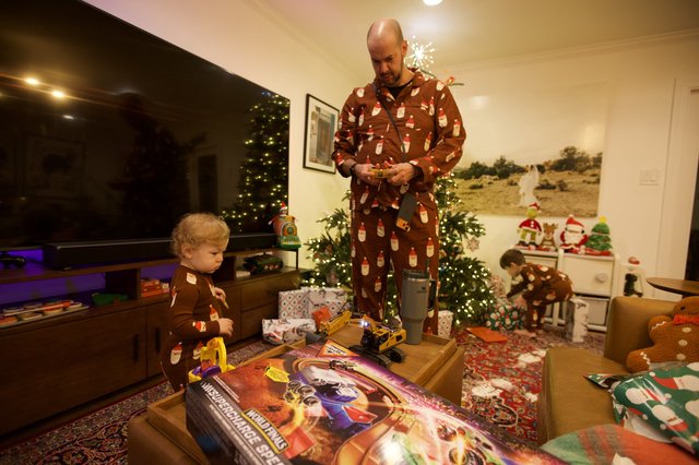 Father and Child's Matching Pajamas Christmas Morning