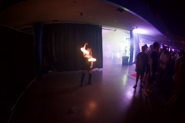 Fire dancer in a dark urban club