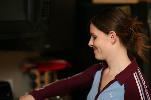 Woman in Profile Smiling Indoors at Night