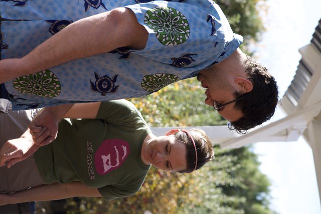 Two Friends Examine Something at Apple Farm