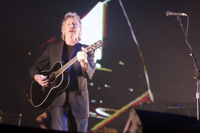 Roger Waters Strums His Guitar on Stage