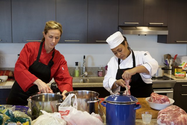 Two Female Chefs Busy in Preparing Delicious Food