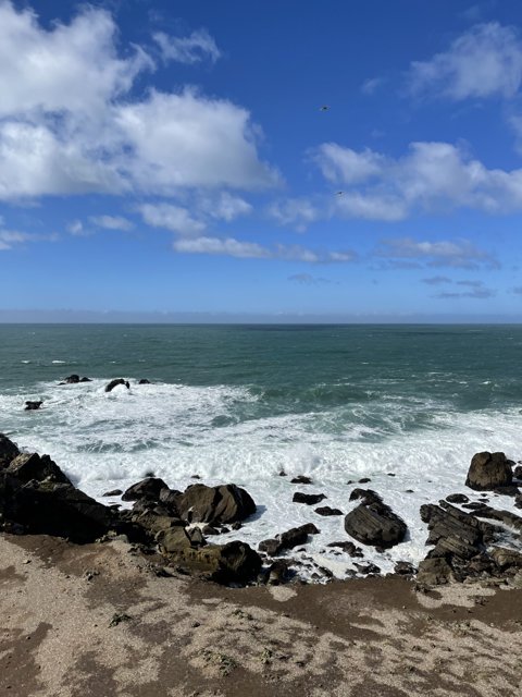 A Scenic View of the Ocean from the Rocky Shore in Jenner, California