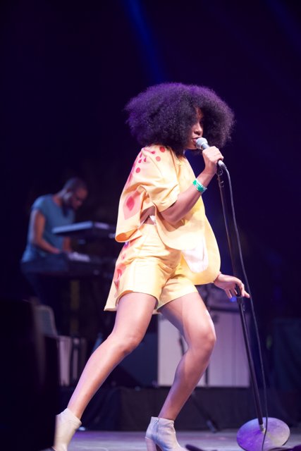 Solange Takes the Stage in Electric Yellow Outfit