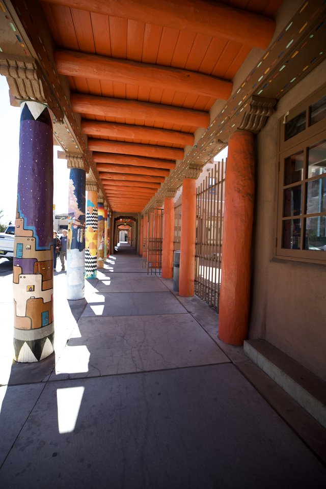 Traditional Adobe Covered Walkway with Painted Columns