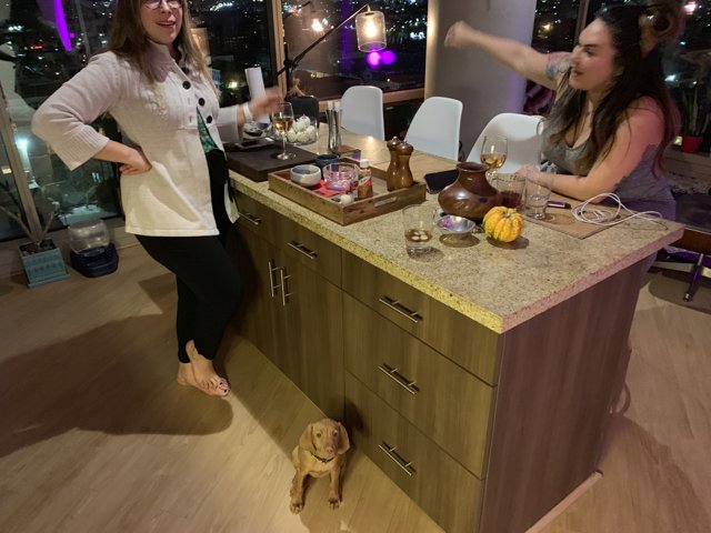 Two Women Gather in the Kitchen