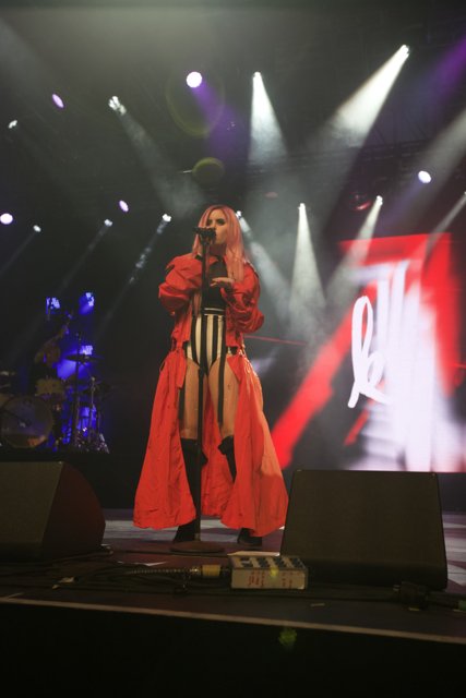 Red Coat and Black Boots on the Coachella Stage