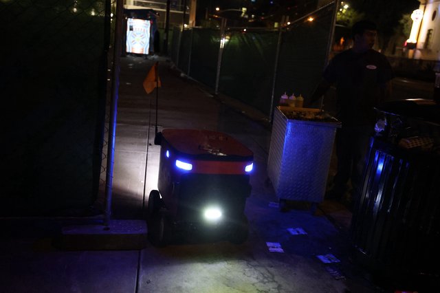 Autonomous Delivery Robot Navigates Nighttime Festival Sidewalk