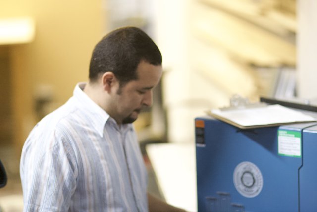 Man Examining Computer Hardware