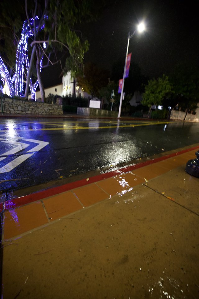 Flooded Street with Directional Markings at Night