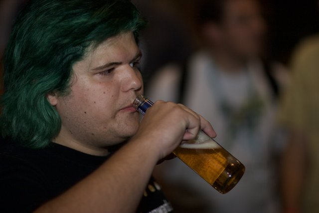 Green-Haired Man Enjoying a Cold Beer