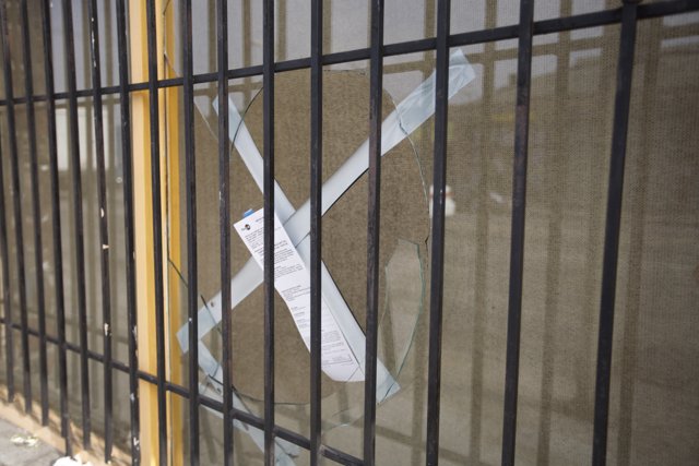 Warning Sign on Prison Fence