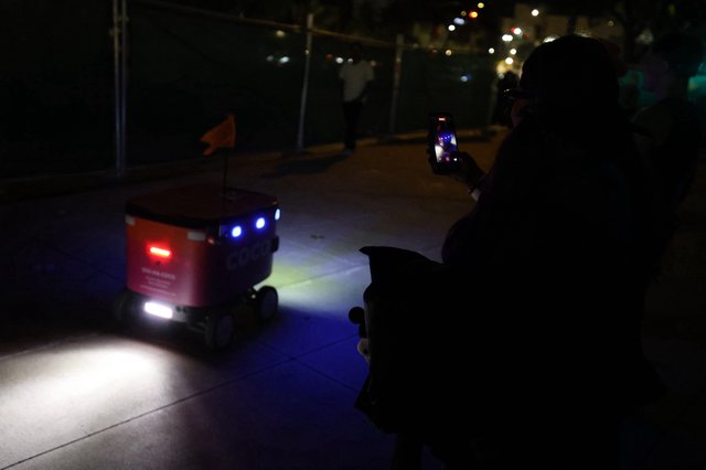 Coco Delivery Robot Navigates Night Festival Sidewalk