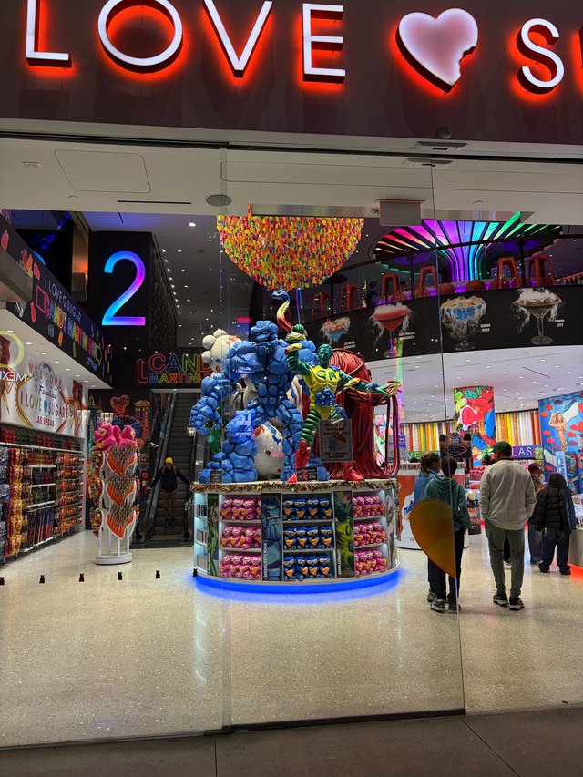 Colorful Candy Store Display with Blue Balloon Sculpture