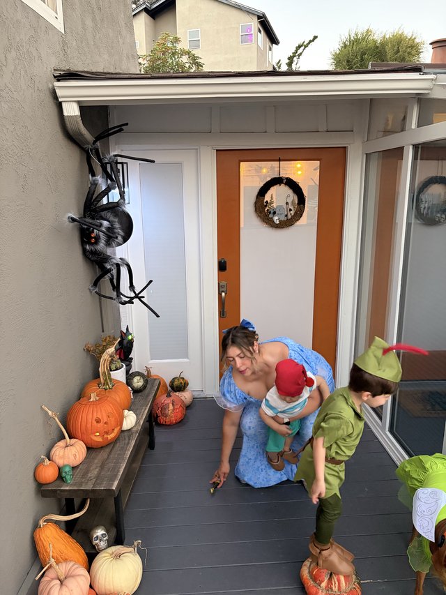 Family Halloween Celebration on Decorated Front Porch