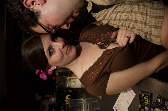 Couple Sharing Intimate Moment at Night Venue