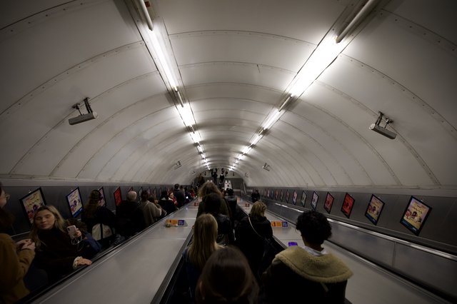 Commuters on London Underground Escalator During Morning Rush