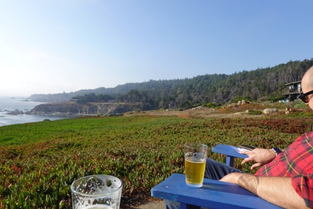 Enjoying a Cold Beer with a Scenic Ocean View