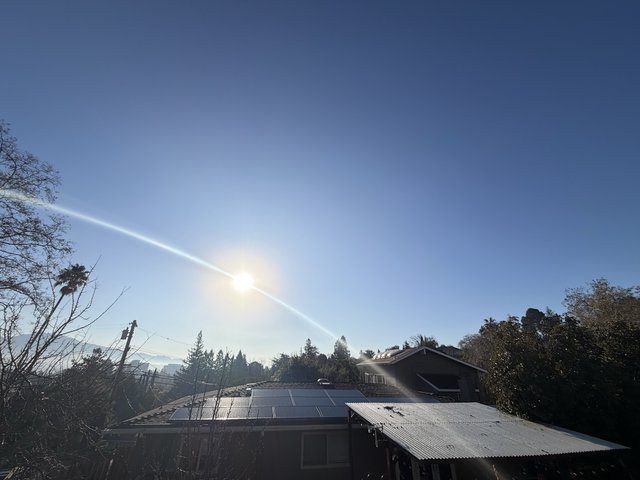 Solar Panels and Suburban Sunset in California Neighborhood