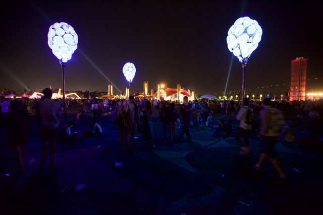 Nighttime Crowd with Balloons at Cochella Festival